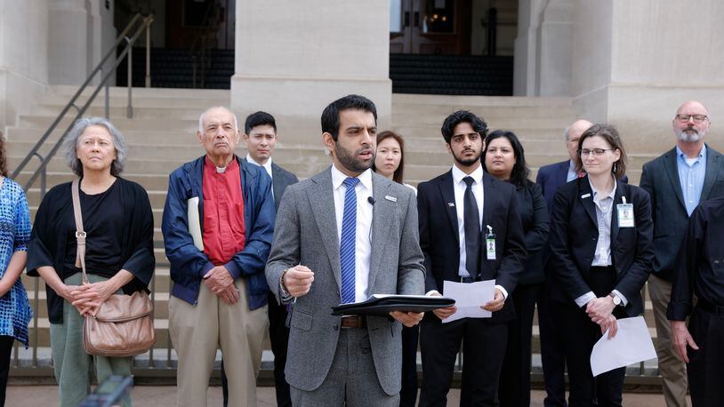 Surrounded by several groups, Murtaza Khwaja, executive director of the Council on American-Islamic Relations speaks during a press conference Monday opposing House Bill 144, also known as the antisemitism bill.  The bill, which would have defined antisemitism so that it would be included under coverage by Georgia’s hate crimes law, fell short of passage during the legislative session that ended Wednesday when it did not get a vote before the state Senate. (Natrice Miller/ natrice.miller@ajc.com)