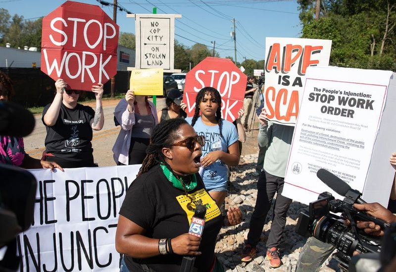 Mary Hooks, center, with the Movement for Black Lives, speaks with media during a protest at the construction site of Atlanta's planned public safety training center on Constitution Road in Atlanta on Sept. 7, 2023 (Riley Bunch/riley.bunch@ajc.com)