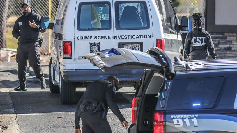 The shooting took place around 9:30 a.m. Tuesday at a Valero gas station in Stone Mountain, DeKalb County police said. (John Spink / John.Spink@ajc.com)