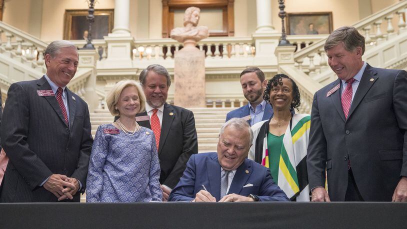 Georgia Governor Nathan Deal signs the 2019 fiscal year state budget at the Georgia State Capitol building in Atlanta, Wednesday. ALYSSA POINTER/ALYSSA.POINTER@AJC.COM