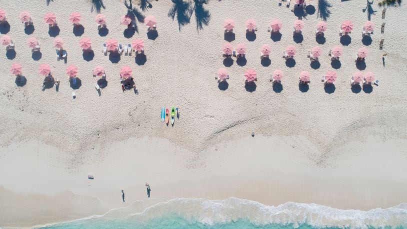 The Ocean Club Resorts' signature pink umbrellas shade one of the world's top beach destinations in Turks & Caicos. 
Courtesy of Ocean Club Resorts
