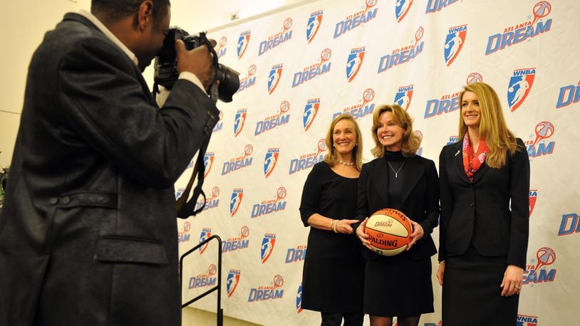 110118 Atlanta :  Atlanta Dream owner Kathy Betty, center,poses for a photo with her new business partners, Mary Brock, left and Kelly Loeffler during a press conference at Philips Arena Tuesday January 18, 2011. Betty, the sole owner since buying the team in 2009, will become the managing partner of the all-female ownership group.  Brant Sanderlin bsanderlin@ajc.com