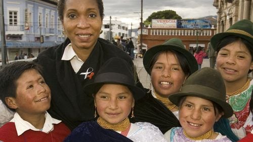 CARE CEO Dr. Helene Gayle with children in Ecuador. She's led CARE since 2006.