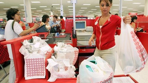 FILE PHOTO: A Target cashier rings up customers at a Target store.