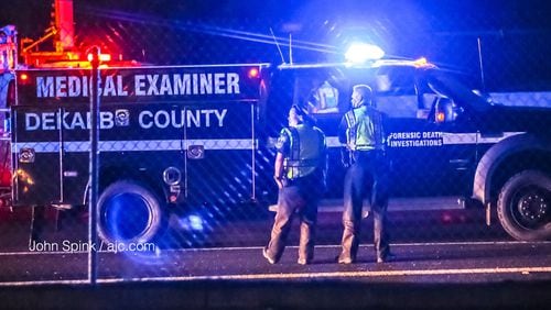 The DeKalb County Medical Examiner was called to the scene of a deadly accident on I-85 North near the North Druid Hills Road exit. JOHN SPINK / JSPINK@AJC.COM