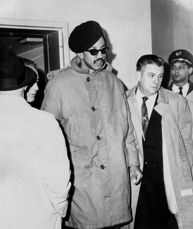 Black Power militant H. Rap Brown is returned to New Orleans by federal agents in February 1968. (Photo credit: Associated Press)