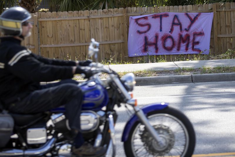 A not-so-welcoming sign greets visitors to Tybee Island on U.S. 80 at the entrance to the island on Saturday, April 4, 2020. (Photo: Stephen B. Morton/ Special to the AJC)