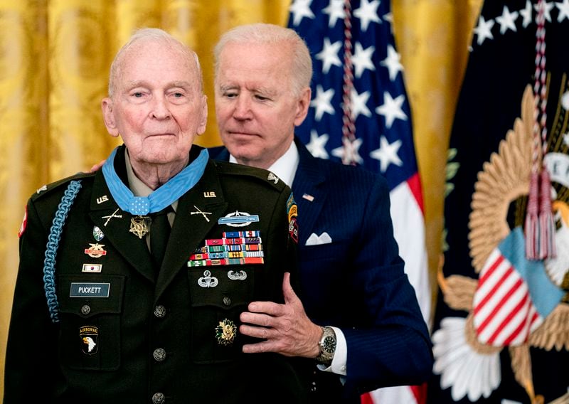 
                        FILE — President Joe Biden presents the Medal of Honor to retired Army Col. Ralph Puckett, Jr., at the White House in Washington, on May 21, 2021. Puckett, who was awarded the Medal of Honor for his exploits commanding vastly outnumbered Army Rangers in a battle with Communist Chinese troops during the Korean War seven decades earlier, died on Monday, April 8, 2024, at his home in Columbus, Ga. One of the most highly decorated servicemen in the history of the Army, he was 97.(Stefani Reynolds/The New York Times)
                      