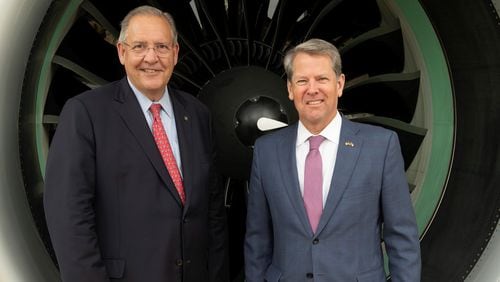 Gregory J. Hayes (left), the chairman and chief executive officer of Raytheon Technologies, and Gov. Brian Kemp posed in front of a Pratt & Whitney GTF engine displayed at the entrance of the RTX pavilion at the Paris Air Show 2023, Le Bourget Airport, Paris, France, on June 20, 2023. (Alex MacNaughton for Raytheon Technologies)