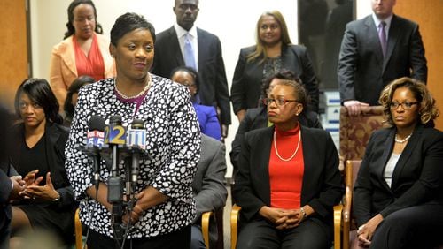 Tamara Cotman and several of the former Atlanta Public Schools educators, among them former APS Dobbs Elementary principal Dana Evans (from left, seated), former APS school reform team director Sharon Davis Williams and former APS Dobbs Elementary teacher Angela Williamson, who were convicted and sentenced to prison, speak during a press conference at the law offices of defense attorney George Lawson on April 17, 2015. KENT D. JOHNSON /KDJOHNSON@AJC.COM