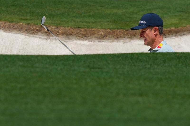 Justin Rose, of England, hits from the bunker on the first hole during the first round at the Masters golf tournament at Augusta National Golf Club Thursday, April 11, 2024, in Augusta, Ga. (AP Photo/Matt Slocum)