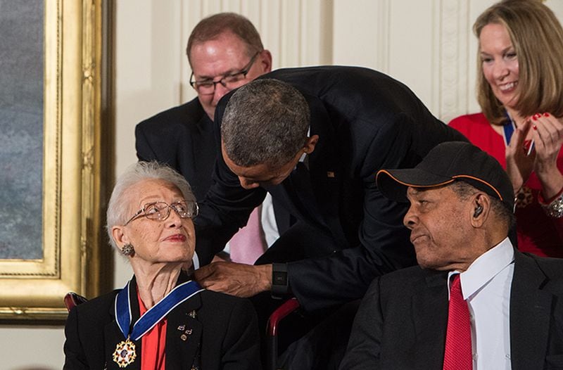 President Barack Obama presents the Presidential Medal of Freedom to NASA mathematician and physicist Katherine Johnson at the White House in Washington, DC, on November 24, 2015.