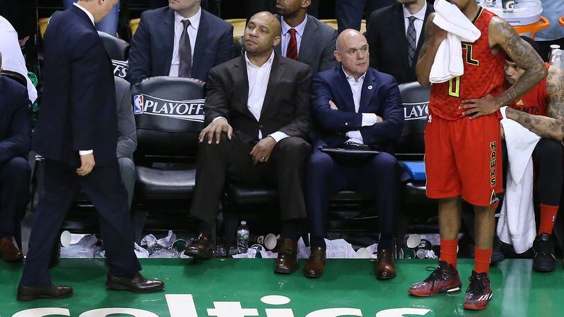 **** SECONDARY PHOTO **** 042416 BOSTON: Hawks head coach Mike Budenholzer (left) and guard Jeff Teague react to falling to the Celtics 104-95 in overtime in Game 4 of an NBA basketball first-round playoff series on Sunday, April 24, 2016, in Boston. The Celtics victory ties the series two games to two heading back to Atlanta for game five. Curtis Compton / ccompton@ajc.com