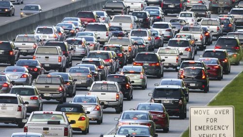 The gridlock of rush hour traffic along GA 400. JOHN SPINK / JSPINK@AJC.COM