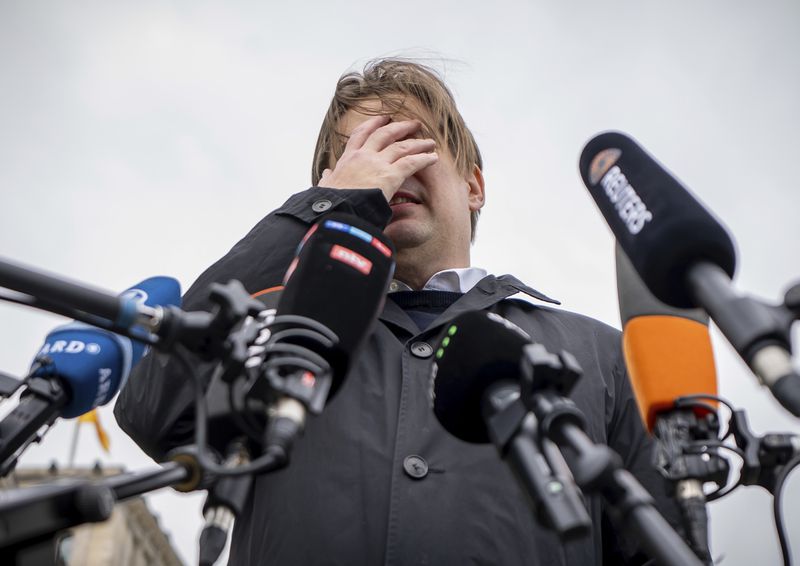 Maximilian Krah, AfD lead candidate for the European elections, makes a press statement after talks with the AfD parliamentary group leadership, Wednesday, April 24, 2024, in Berlin.. One of Krah's employees is suspected of spying for China. (Michael Kappeler/dpa via AP)