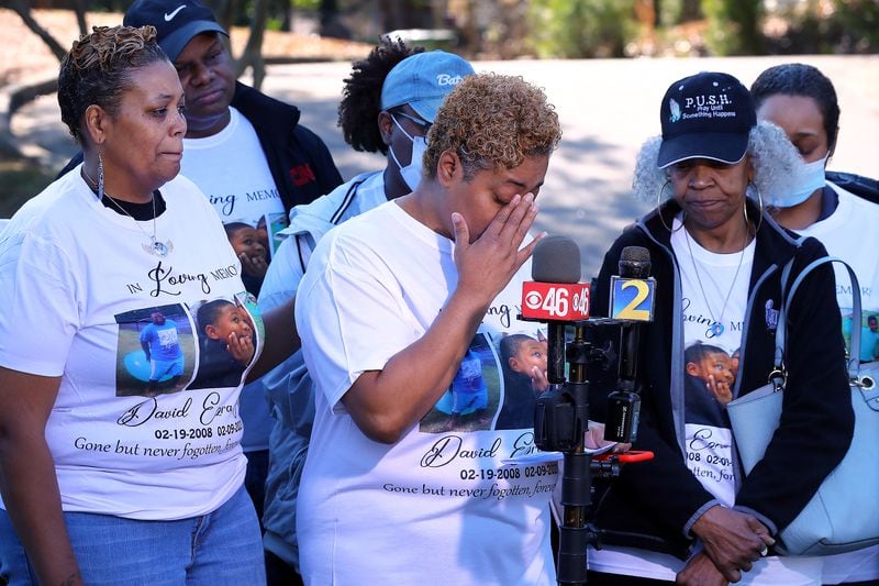 020922 ATLANTA: David Mack's aunts Ayana Riley (from left), Radiah Allen, and grandmother Glenda Mack become emotional during a press conference by the family looking for answers a year after his murder on Wednesday, Feb. 9, 2022, in Atlanta. David Mack, 12, disappeared, after saying he was going to visit a friend. The next day, his body was found along the concrete slope of Utoy Creek in some woods near his home. David’s grieving family is sure there is someone out there who could come forward to help them find out who shot and killed him, and why.  “Curtis Compton / Curtis.Compton@ajc.com”`