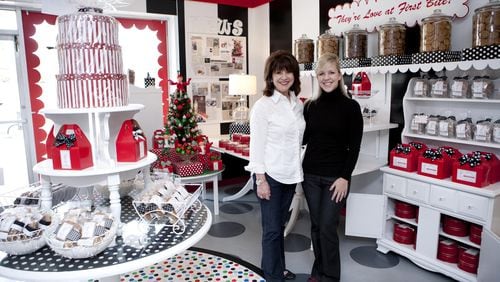 Mother-daughter entrepreneurs, Laura Stachler (right) and Susan Stachler (right), stand in their Sandy Springs cookie shop, Susansnaps. Photo by Pink Shoe Photography.