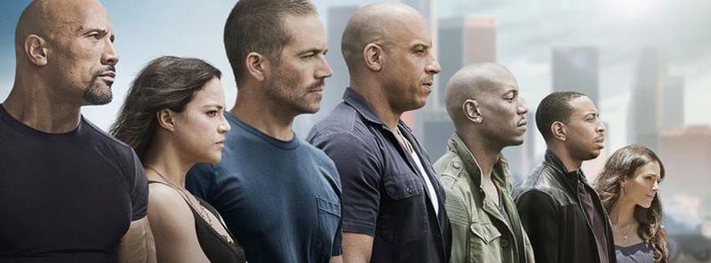 This promotional image for “Fast & Furious 7″ shows the late Paul Walker with his co-stars.