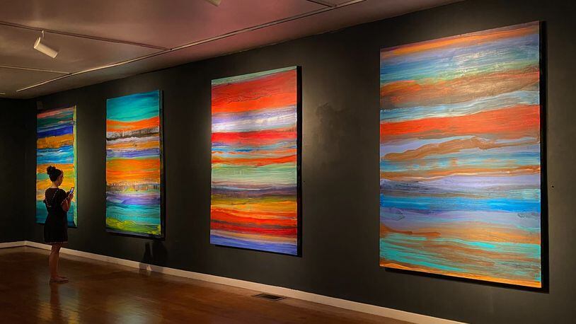 Deanna Sirlin's paintings glow with color in her "Wavelength" exhibit at Chastain Gallery.