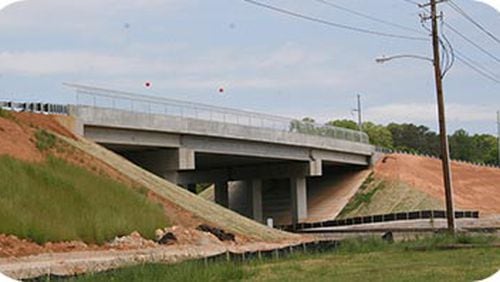 Henry County commissioners are calling on the state DOT to get started on the Western Parallel Connector.