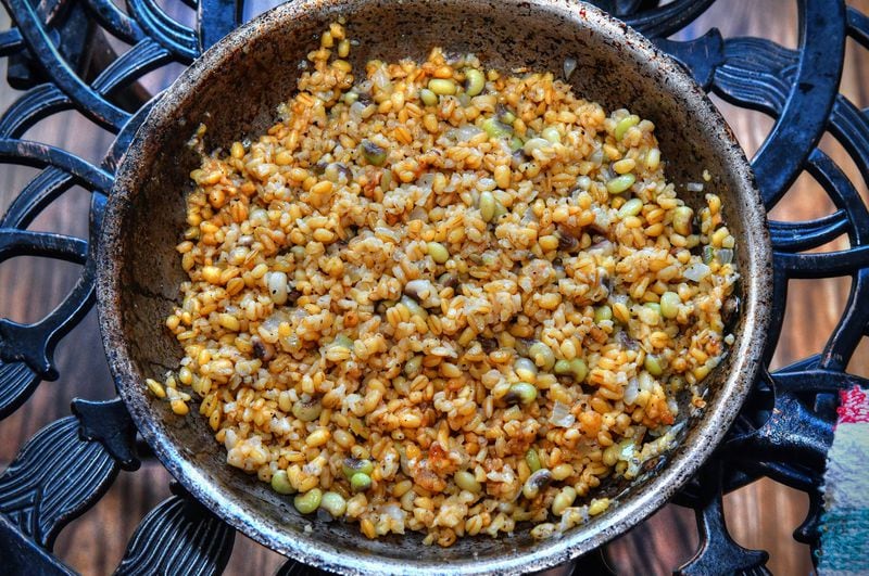 Chef Shay Lavi of Nur Kitchen on Buford Highway makes this Pilaf of Bulgur and Peas. Use any kind of peas or beans in this bulgur pilaf -- chickpeas, English peas, butterbeans, baby limas. Lavi likes Southern field peas. The dish pairs well with Shay Lavi's Roasted Okra. (Styling by chef Shay Lavi / Chris Hunt for the AJC)