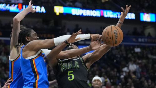 Oklahoma City Thunder forward Jalen Williams strips the ball from New Orleans Pelicans forward Herbert Jones (5) in the first half of Game 4 of an NBA basketball first-round playoff series in New Orleans, Monday, April 29, 2024. (AP Photo/Gerald Herbert)