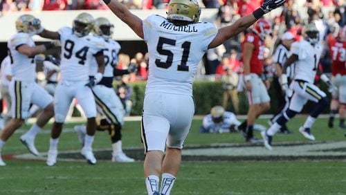Georgia Tech linebacker Brant Mitchell celebrates his game-ending interception in the Yellow Jackets’ 28-27 victory over Georgia on Saturday, Nov. 26, 2016, in Athens. Curtis Compton/ccompton@ajc.com