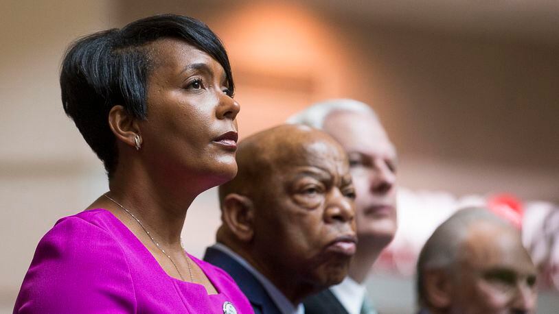 04/08/2019 — Atlanta, Georgia — Atlanta Mayor Keisha Lance Bottoms (left) sits with U.S. Congressman John Lewis (second from left) during a tribute to Congressman John Lewis in the atrium of the domestic terminal at Atlanta’s Hartsfield Jackson International Airport, Monday, April 8, 2019. The art exhibit “John Lewis-Good Trouble” was unveiled Monday with historical artifacts, audio and visual installations and tributes to the congressman. (ALYSSA POINTER/ALYSSA.POINTER@AJC.COM)