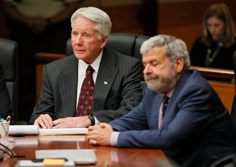 Tex McIver (left) and defense attorney Don Samuel react to the jury’s verdict that McIver was found guilty of felony murder. (Bob Andres / bandres@ajc.com)