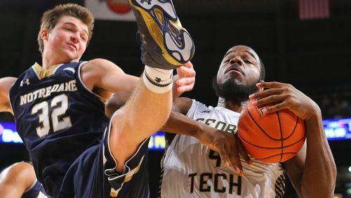 Georgia Tech's Demarco Cox battles Notre Dame's Steve Vasturia (32) for a rebound during the second half at McCamish Pavilion in Atlanta on Wednesday, Jan. 14, 2015. Notre Dame won, 62-59. (Curtis Compton/Atlanta Journal-Constitution/TNS) Georgia Tech center Demarco Cox's career-high 17 points were not enough to lift the Yellow Jackets to their first ACC win of the season. (ASSOCIATED PRESS)