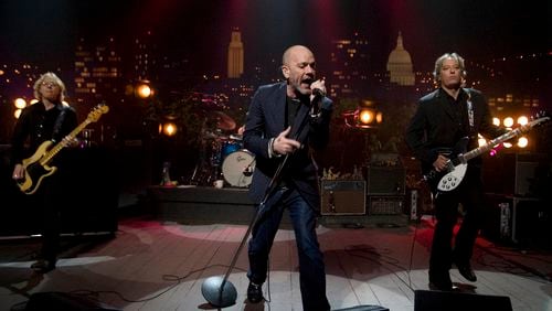 Left to right, Mike Mills, Michael Stipe and Peter Buck of R.E.M. perform on “Austin City Limits” on Thursday March 13, 2008. Stipe has been a vocal opponent of Georgia’s “campus carry” legislation.