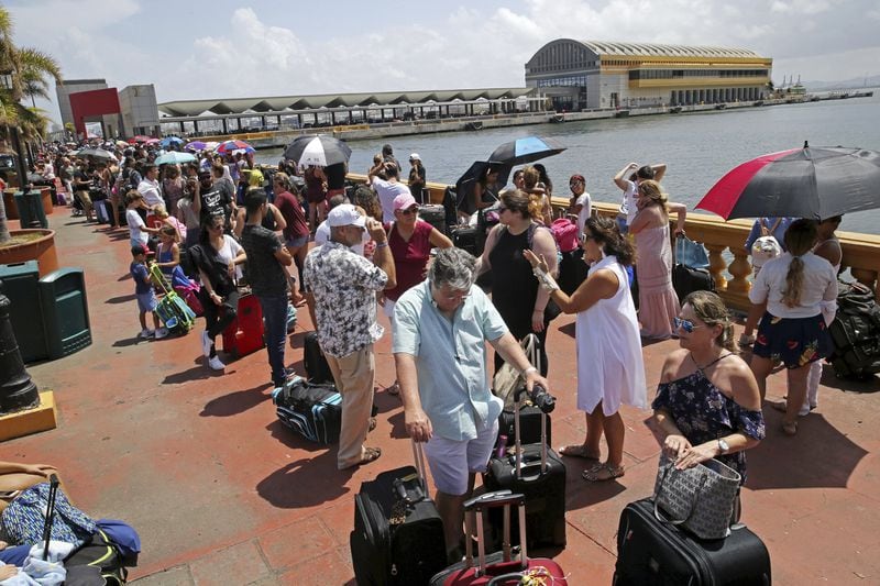 Thousands of people evacuating Puerto Rico line up to get on a cruise ship in the aftermath of Hurricane Maria in San Juan, Thursday. (Associated Press / Gerald Herbert)