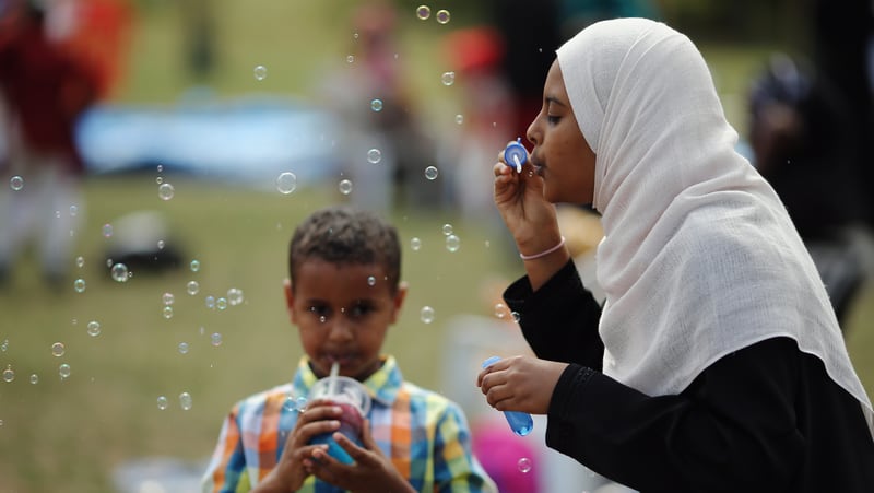 A girl blows bubbles during an Eid celebration in London, England.