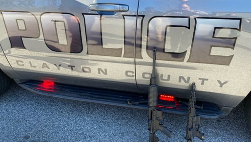 An armed man, who prompted a shelter-in-place order in Clayton County, was taken into custody Friday, police said.