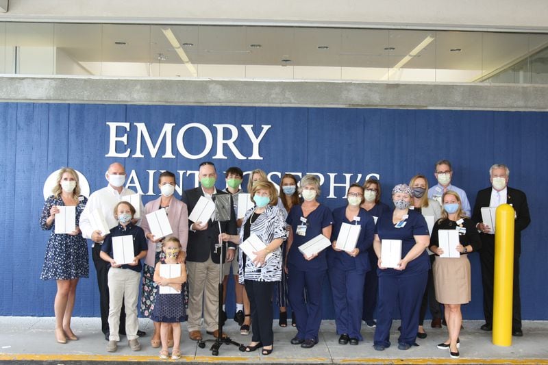 The Drye family is pictured with nurses and staff at Emory Saint Joseph's Hospital in August when they donated 47 iPads. Photo Courtesy Emory Saint Joseph's Hospital