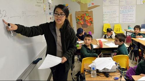 Second-grade teacher Dinna Duong teaches her class at Amana Academy in Alpharetta.