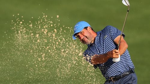 Jose Maria Olazabal hits his sand shot from the bunker to the 10th green during Thursday’s pro-am for the Mitsubishi Electric Classic at TPC Sugarloaf in Duluth. (Curtis Compton/ccompton@ajc.com)
