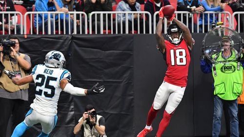 Falcons wide receiver Calvin Ridley catches a touchdown pass in the corner of the end zone during the Dec. 8 game against Carolina. (Hyosub Shin/Hyosub.Shin@ajc.com)