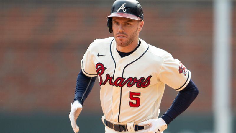 Braves first baseman Freddie Freeman (5) rounds the bases after his solo home run in the seventh inning against the Miami Marlins Sunday, Sept. 12, 2021, at Truist Pak in Atlanta. It was his 30th homer of the season. (Hakim Wright Sr./AP)