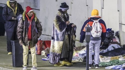 January 9, 2019 Atlanta: Leroy Thomas (third from left) says the Atlanta police told the people staying on Bell Street in Atlanta under the downtown connector sleeping overnight that they would all need to be cleared and out of the area by this Saturday because of the Super Bowl. With forecasters warning of dangerous cold ahead this winter, the homeless population are vulnerable in the metro Atlanta area. While the number of persons who have succumb to the cold is less than last years count, there is still a long way to go before this winter is over and temperatures moderate. JOHN SPINK/JSPINK@AJC.COM