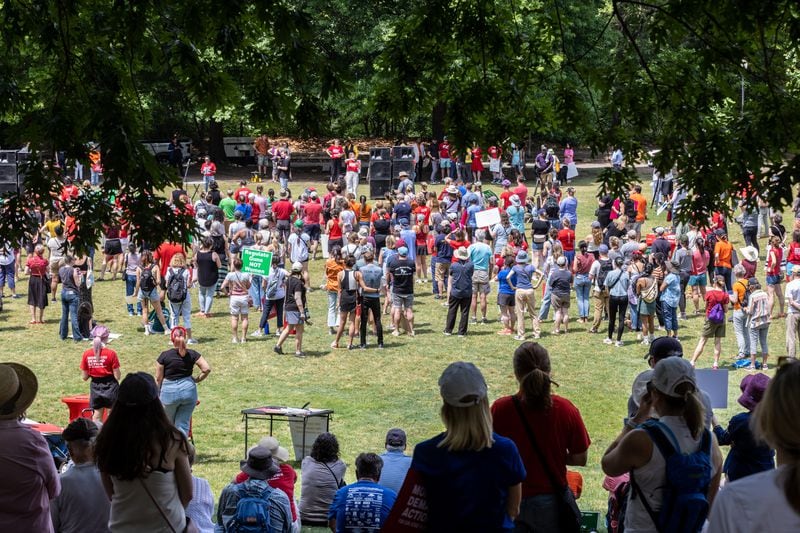 A crowd listens to the speakers during a rally organized by Georgia Moms Demand Action in Piedmont Park Saturday, May 13, 2023. The rally was part of a national series of protests the day before Mother’s Day to highlight the mounting toll of gun violence.  (Steve Schaefer/steve.schaefer@ajc.com)
