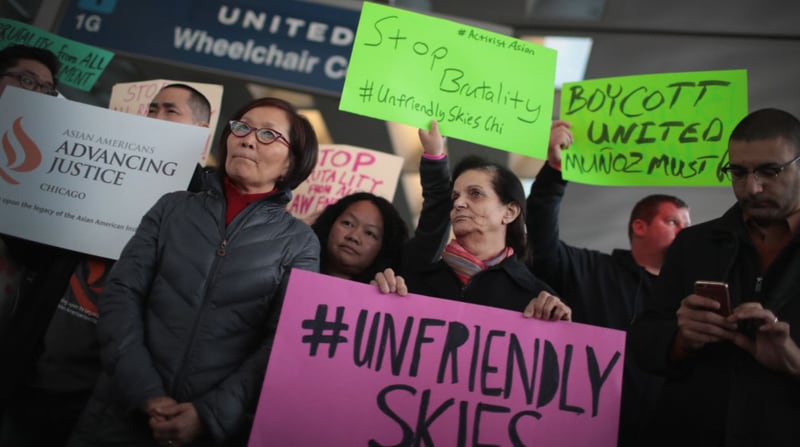 CHICAGO, IL - APRIL 11:  Demonstrators protest outside the United Airlines terminal at O'Hare International Airport on April 11, 2017 in Chicago, Illinois. United Airlines has been struggling to restore their corporate image after a cell phone video was released showing a passenger being dragged from his seat and bloodied by airport police after he refused to leave a reportedly overbooked flight.  (Photo by Scott Olson/Getty Images)