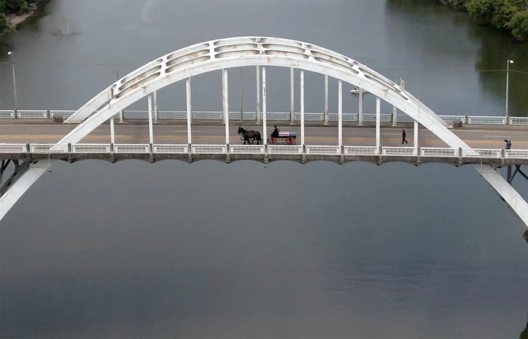 John Lewis crosses Edmund Pettus Bridge for final time
