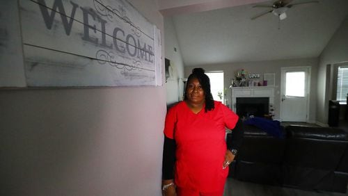 *** VISUAL LEDE *** 020722 SNELLVILLE: Sharanda Hendrickson, a high school nurse, stands in the foyer of her home on Monday, Feb. 7, 2022, in Snellville, discussing how she and her husband had trouble finding housing when their last lease ended in 2020. They are currently renting this home south of Snellville while having to put their dreams of buying a home on hold. Gwinnett leaders face predictions of massive unmet housing demand in Gwinnett County for the next 20 years.  “Curtis Compton / Curtis.Compton@ajc.com”`