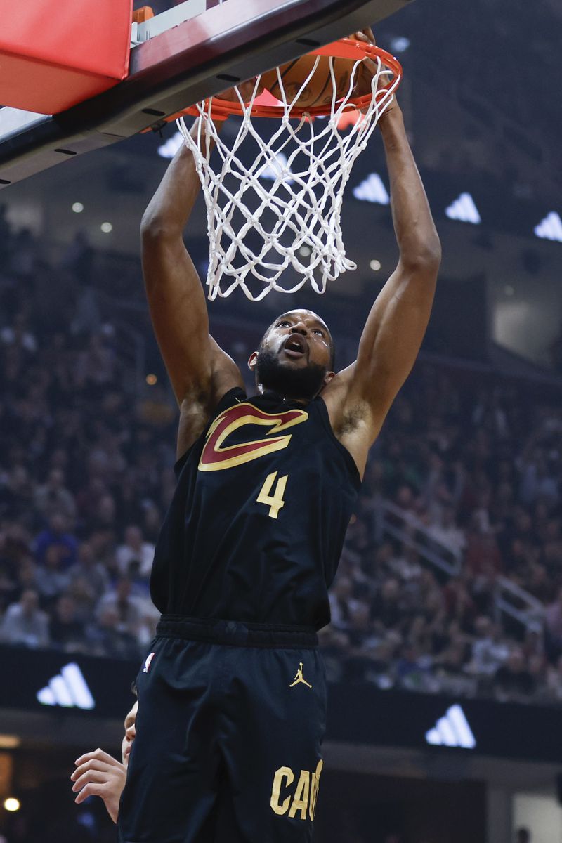 Cleveland Cavaliers forward Evan Mobley dunks against the Orlando Magic during the first half of Game 5 of an NBA basketball first-round playoff series, Tuesday, April 30, 2024, in Cleveland. (AP Photo/Ron Schwane)