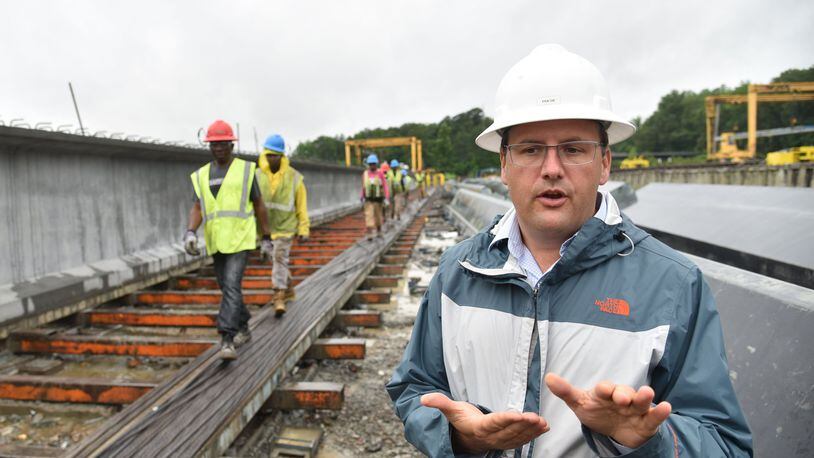 Mason Lampton, chief executive of Standard Concrete Products, explains how highway girders in the I-85 repair project were made at the company’s Atlanta location. It produced the girders at a record pace to get the job done. HYOSUB SHIN / HSHIN@AJC.COM