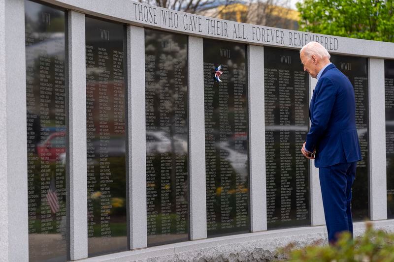 President Joe Biden pauses at a wall of veterans' names at a Scranton war memorial, Wednesday, April 17, 2024, in Scranton, Pa. (AP Photo/Alex Brandon)