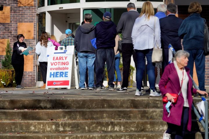 Fulton county residents take advantage of early voting Monday morning in Atlanta. Lines stretched out the door at the Northside branch library on Monday, Nov. 28, 2022.  (Ben Hendren for the Atlanta Journal Constitution) 