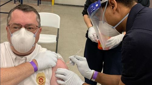 Cobb County EMS Division Chief Nick Adams received a COVID-19 vaccine on Tuesday. Cobb County Fire & Emergency Services is administering the vaccine voluntarily to its staff, including firefighters. Credit: Cobb County Fire & Emergency Services