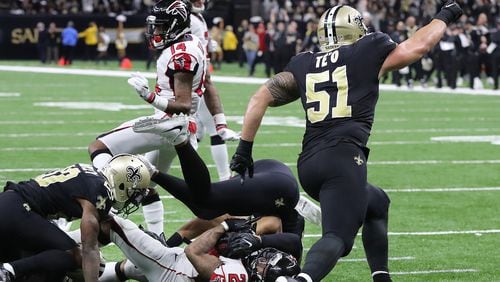 New Orleans linebacker Manti Te’o  reacts as the goal line defense stops Falcons running back Devonta Freeman just short of the endzone on a fourth down attempt during the fourth quarter. The Falcons lost to the Saints 23-13 and need a win next week to secure a playoff berth.